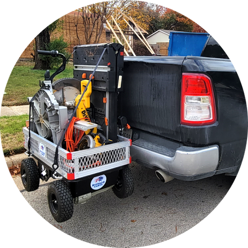 Tool cart parked at pickup truck tailgate