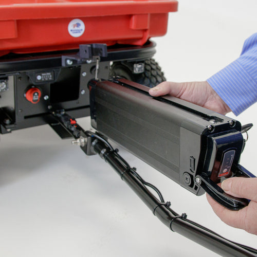 Removable battery being inserted into Buffalo Cart